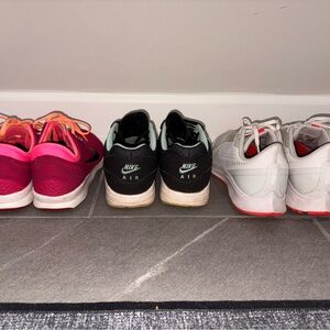 Women 7.5 Nike Sneakers in Pink, Black, and White